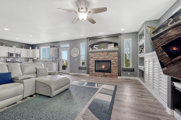Fireplace, Interior, Kitchen, Living room, Recessed Lighting, Stone Walls, Wood Texture Flooring