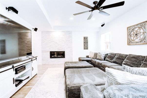 Fireplace, Interior, Living room, Recessed Lighting, Stone Walls, Wood Texture Flooring