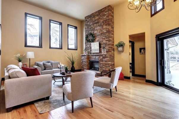 Chandelier, Fireplace, Interior, Living room, Stone Walls, Wood Texture Flooring