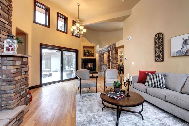 Chandelier, Fireplace, Interior, Living room, Stone Walls, Wood Texture Flooring