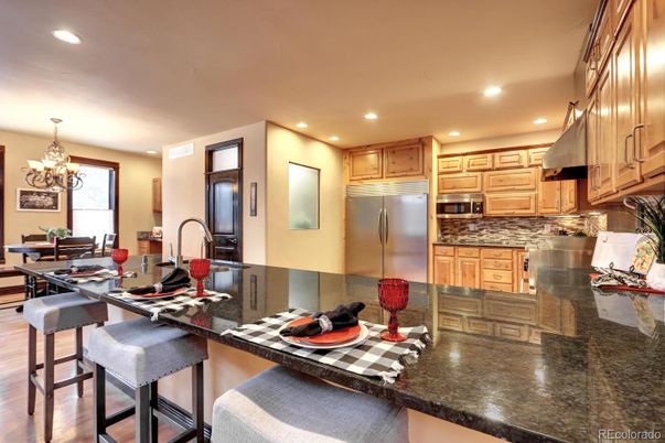 Chandelier, Dining room, Interior, Kitchen, Recessed Lighting, Stainless Steel Appliances, Wood Texture Flooring