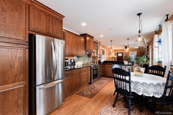 Dining room, Interior, Kitchen, Pendant Lights, Recessed Lighting, Stainless Steel Appliances, Wood Texture Flooring