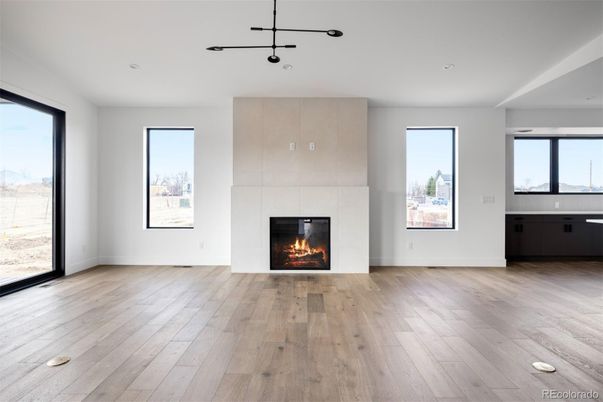 Empty room, Fireplace, Interior, Pendant Lights, Recessed Lighting, Wood Texture Flooring