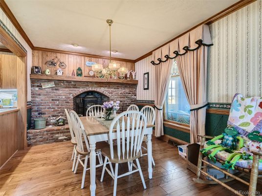 Dining room, Fireplace, Interior, Pendant Lights, Stone Walls, Wood Texture Flooring