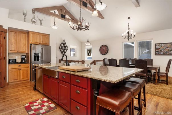 Chandelier, Dining room, Interior, Kitchen, Pendant Lights, Stainless Steel Appliances, Wood Texture Flooring