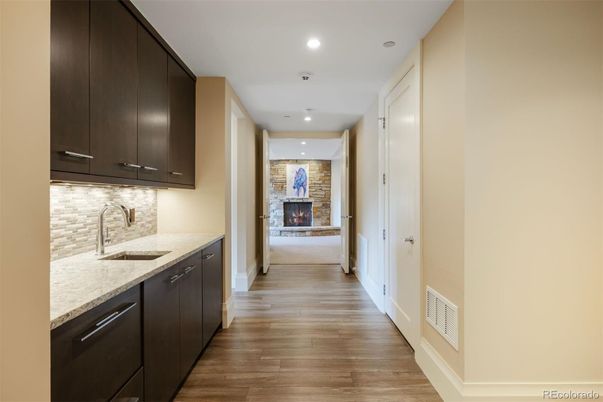 Fireplace, Interior, Kitchen, Recessed Lighting, Stone Walls, Wood Texture Flooring