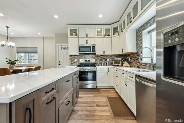 Chandelier, Interior, Kitchen, Pendant Lights, Recessed Lighting, Stainless Steel Appliances, Wood Texture Flooring