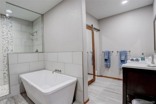 Bathroom, Dual Sink Vanities, Free Standing Baths, Interior, Recessed Lighting, Wood Texture Flooring