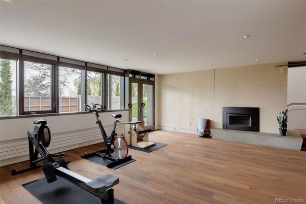 Fireplace, Fitness Equipment, Interior, Recessed Lighting, Wood Texture Flooring