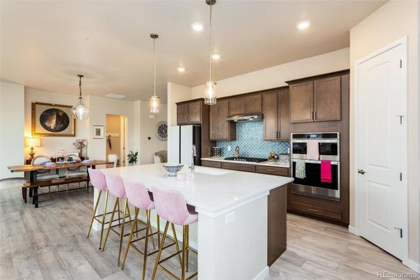 Dining room, Interior, Kitchen, Pendant Lights, Recessed Lighting, Stainless Steel Appliances, Wood Texture Flooring