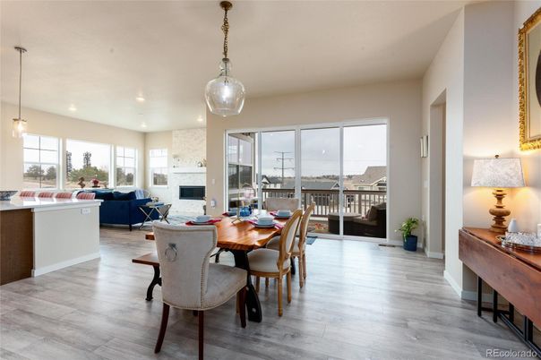 Dining room, Fireplace, Interior, Living room, Pendant Lights, Recessed Lighting, Wood Texture Flooring