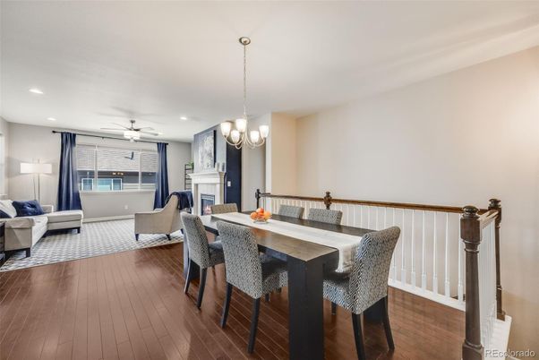 Chandelier, Dining room, Fireplace, Interior, Living room, Pendant Lights, Recessed Lighting, Wood Texture Flooring
