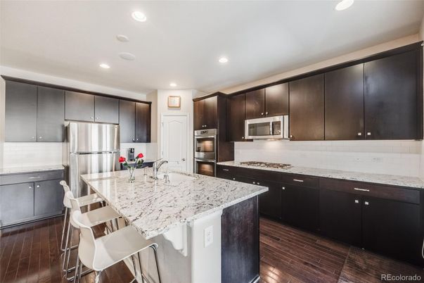 Interior, Kitchen, Recessed Lighting, Stainless Steel Appliances, Wood Texture Flooring