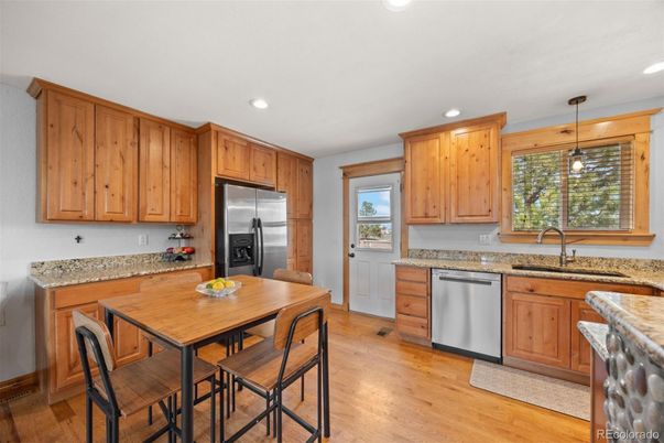 Dining room, Interior, Kitchen, Pendant Lights, Recessed Lighting, Stainless Steel Appliances, Wood Texture Flooring