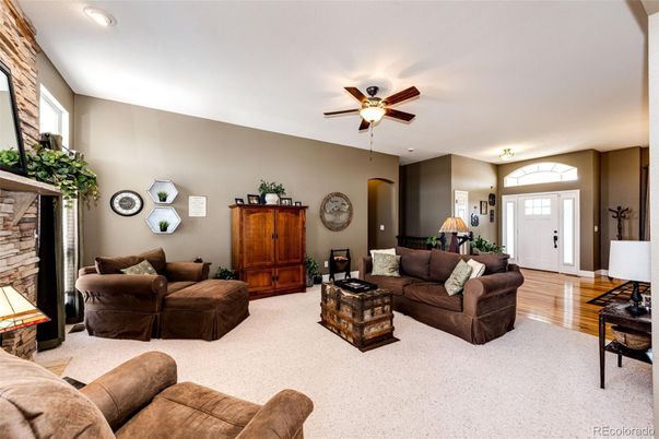 Fireplace, Interior, Living room, Recessed Lighting, Stone Walls, Wood Texture Flooring
