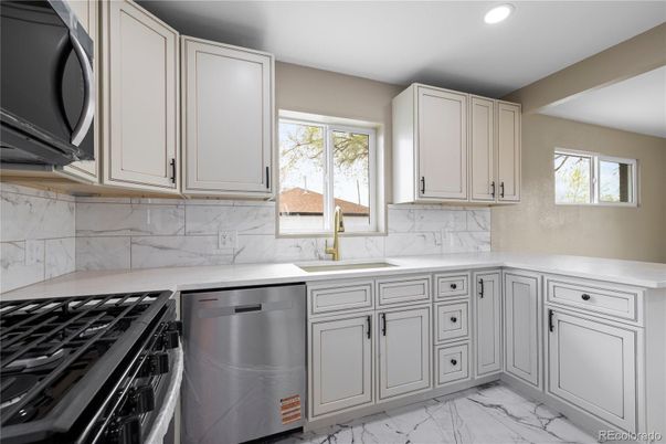 Interior, Kitchen, Marble, Marble Walls, Recessed Lighting, Stainless Steel Appliances