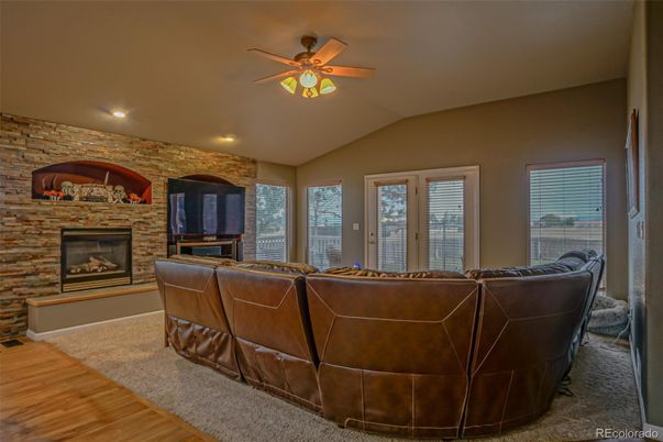 Fireplace, Interior, Living room, Recessed Lighting, Stone Walls, Wood Texture Flooring