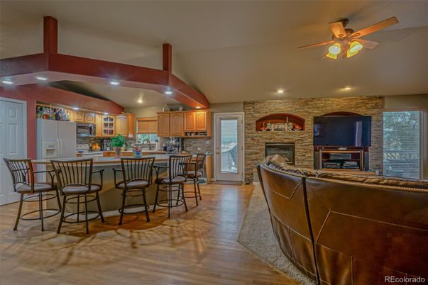 Fireplace, Interior, Kitchen, Recessed Lighting, Stone Walls, Wood Texture Flooring