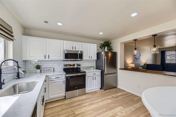 Interior, Kitchen, Pendant Lights, Recessed Lighting, Stainless Steel Appliances, Wood Texture Flooring