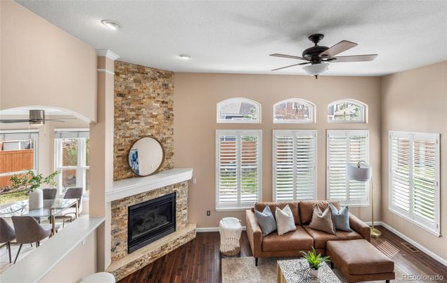Dining room, Fireplace, Interior, Living room, Recessed Lighting, Stone Walls, Wood Texture Flooring