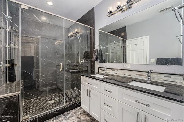 Bathroom, Dual Sink Vanities, Glass Shower, Interior, Marble, Marble Walls, Recessed Lighting