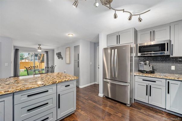 Dining room, Interior, Kitchen, Recessed Lighting, Stainless Steel Appliances, Wood Texture Flooring