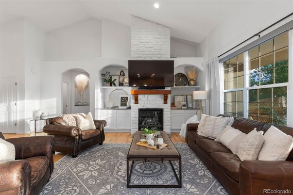 Fireplace, Interior, Living room, Recessed Lighting, Stone Walls, Wood Texture Flooring