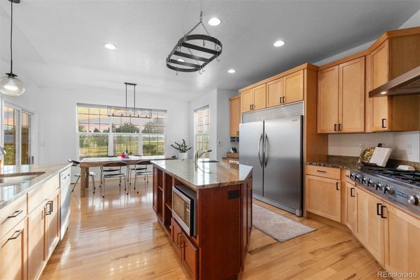 Dining room, Interior, Kitchen, Pendant Lights, Recessed Lighting, Stainless Steel Appliances, Wood Texture Flooring