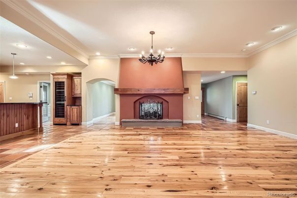 Chandelier, Empty room, Fireplace, Interior, Pendant Lights, Recessed Lighting, Wood Texture Flooring