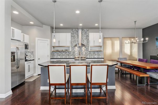Dining room, Interior, Kitchen, Pendant Lights, Recessed Lighting, Stainless Steel Appliances, Wood Texture Flooring