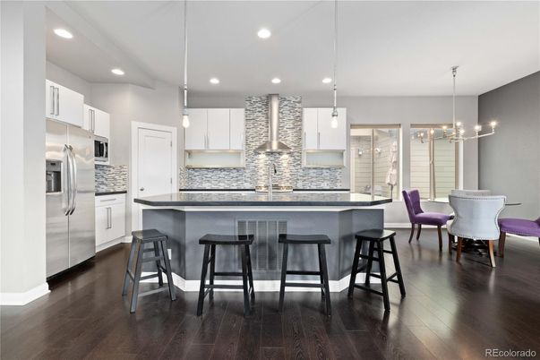 Dining room, Interior, Kitchen, Pendant Lights, Recessed Lighting, Stainless Steel Appliances, Wood Texture Flooring