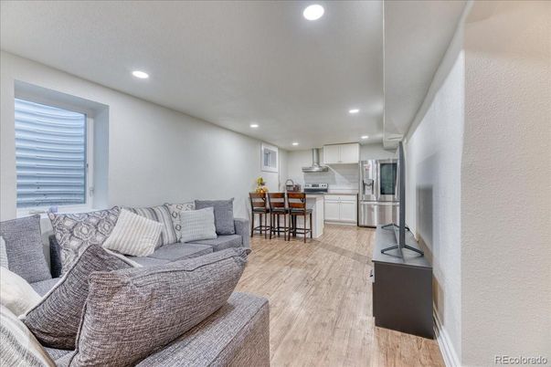 Dining room, Interior, Kitchen, Living room, Recessed Lighting, Stainless Steel Appliances, Wood Texture Flooring