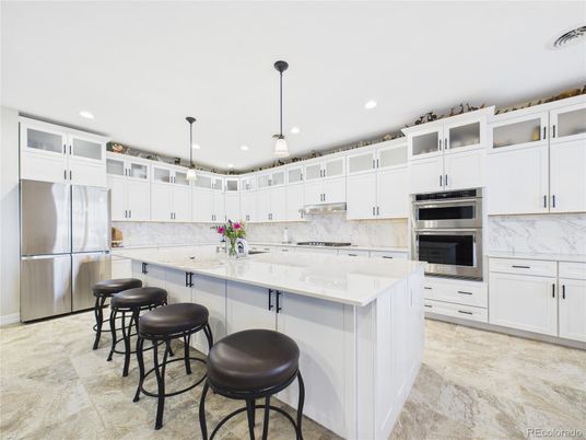 Interior, Kitchen, Marble Walls, Pendant Lights, Recessed Lighting, Stainless Steel Appliances