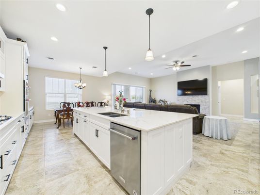 Chandelier, Dining room, Fireplace, Interior, Kitchen, Living room, Pendant Lights, Recessed Lighting, Stainless Steel Appliances