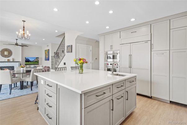 Chandelier, Dining room, Fireplace, Interior, Kitchen, Pendant Lights, Recessed Lighting, Stainless Steel Appliances, Wood Texture Flooring