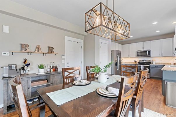 Dining room, Interior, Kitchen, Pendant Lights, Recessed Lighting, Stainless Steel Appliances, Wood Texture Flooring