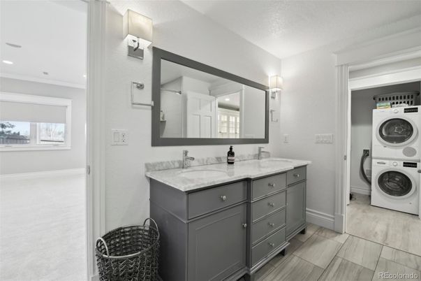 Bathroom, Dual Sink Vanities, Interior, Recessed Lighting, Utility Closets, Washer, Wood Texture Flooring