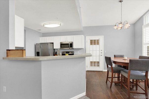 Dining room, Interior, Kitchen, Pendant Lights, Stainless Steel Appliances, Wood Texture Flooring