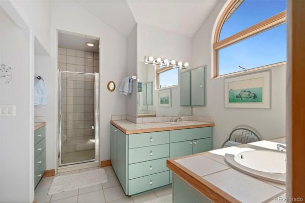 Bathroom, Dual Sink Vanities, Glass Shower, Interior, Recessed Lighting, Tile Countertops