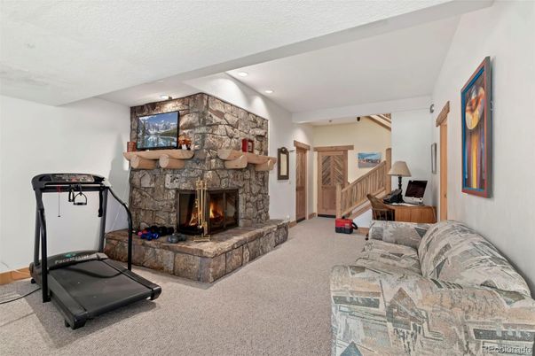 Fireplace, Fitness Equipment, Interior, Recessed Lighting, Stone Walls