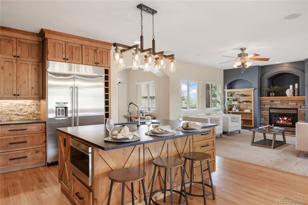 Fireplace, Interior, Kitchen, Living room, Pendant Lights, Recessed Lighting, Stainless Steel Appliances, Wood Texture Flooring