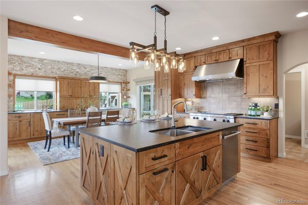 Dining room, Interior, Kitchen, Pendant Lights, Recessed Lighting, Stainless Steel Appliances, Wooden Beams, Wood Texture Flooring