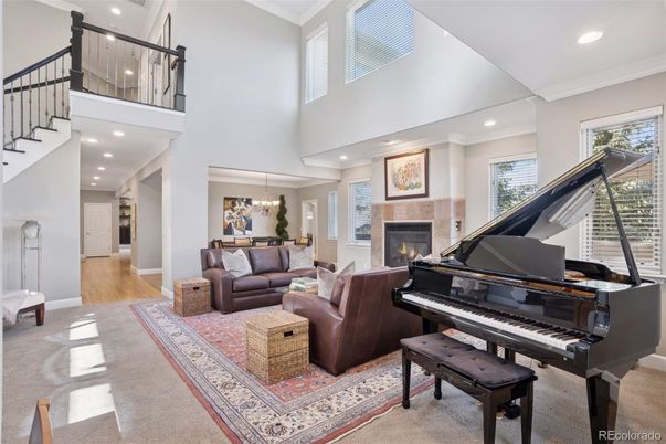 Chandelier, Dining room, Fireplace, Interior, Living room, Piano, Recessed Lighting, Wood Texture Flooring