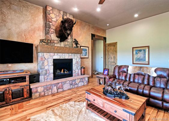 Fireplace, Interior, Living room, Recessed Lighting, Stone Walls, Wood Texture Flooring