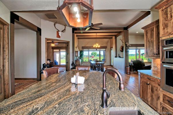 Chandelier, Dining room, Interior, Kitchen, Recessed Lighting, Stainless Steel Appliances, Wood Texture Flooring