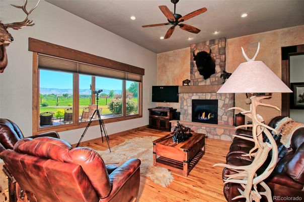 Fireplace, Interior, Living room, Recessed Lighting, Stone Walls, Wood Texture Flooring