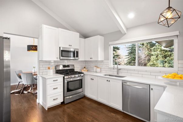 Dining room, Interior, Kitchen, Pendant Lights, Recessed Lighting, Stainless Steel Appliances, Wood Texture Flooring