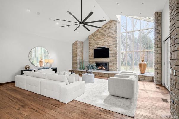Fireplace, Interior, Living room, Recessed Lighting, Stone Walls, Wood Texture Flooring