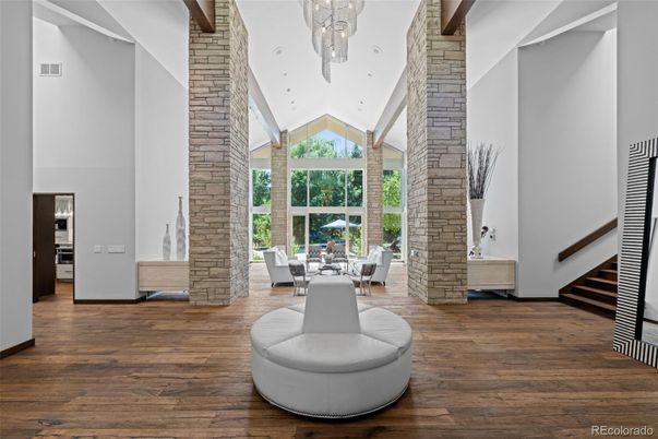 Chandelier, Dining room, Fireplace, Interior, Stone Walls, Wood Texture Flooring