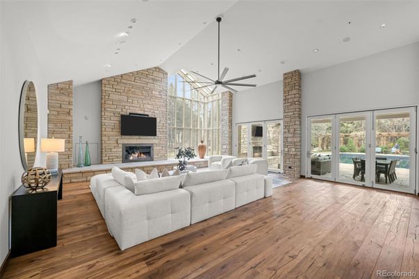 Fireplace, Interior, Living room, Recessed Lighting, Stone Walls, Wood Texture Flooring